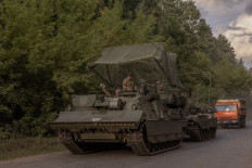 Ukrainian servicemen operate an armoured military vehicle in the Sumy region, near the border with Russia, on August 13, 2024, amid the Russian invasion of Ukraine. 