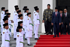 President Joko “Jokowi“ Widodo (third right), accompanied by several members of his cabinet (from right), State Secretary Pratikno, Coordinating Human Development and Culture Minister Muhadjir Effendy and State and Youth and Sports Minister Dito Ariotedjo, inspects members of the 2024 Flag Raising Troop (Paskibraka) after their induction ceremony on Aug. 13, 2024 at Garuda Palace in Nusantara, East Kalimantan.