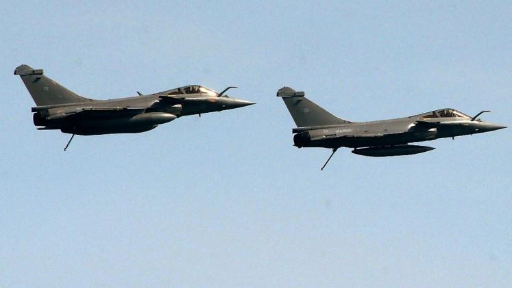 Two French Rafale jet fighters fly during an international military exercise with Indian navy on May 11, 2017 off the coasts of Brest, western France. 