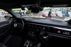 The photo taken on Aug. 1, 2024, shows a general view of the driver's seat and controls of a driverless robotaxi autonomous vehicle developed as part of tech giant Baidu's Apollo Go self-driving project, in Wuhan, in central China's Hubei province.