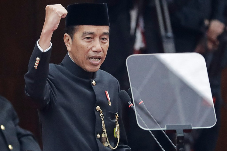 President Joko “Jokowi“ Widodo, wearing traditional Betawi attire, delivers his State of the Nation Address during the annual People's Consultative Assembly (MPR) plenary session at the Senayan legislative complex in Jakarta on Aug. 16, 2024.