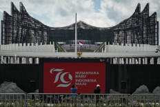 Workers check on the exterior of the State Palace in Nusantara Capital City (IKN), North Penajam Paser regency, East Kalimantan, on Aug. 16, 2024. The future capital city hosted the 79th Independence Day ceremony which was attended by 1,300 guests