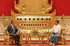 This photograph taken and released on Aug. 14, 2024, by the Myanmar Military Information Team shows Myanmar's military chief Min Aung Hlaing (right) meeting with China's Foreign Minister Wang Yi in Naypyidaw. Myanmar's embattled junta chief and China's foreign minister on Aug.14 discussed security along their shared border where ethnic minority armed groups have captured territory from the Myanmar military in recent weeks, junta media said.