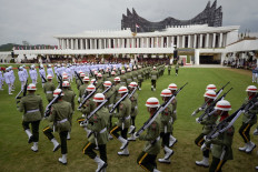 Service personnel take part in the flag-raising ceremony marking the 79th Independence Day at the presidential palace in Nusantara, North Penajam Paser regency, East Kalimantan, on Aug. 17, 2024.