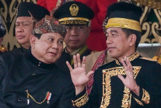 President Joko “Jokowi“ Widodo (right) talks to Defense Minister and president-elect Prabowo Subianto (left) on Aug. 17, 2024, following a flag-raising ceremony marking the 79th Independence Day at the Garuda Palace in Nusantara, North Penajam Paser regency, East Kalimantan.