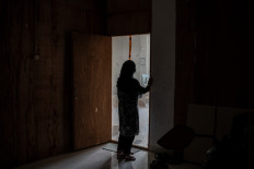 A portrait of Sahafira Ahklaqi (40), an asylum seeker from Afghanistan, after being interviewed at a refugee camp at the former Military District Command (Kodim) in Kalideres, West Jakarta, on Aug. 15, 2024. 