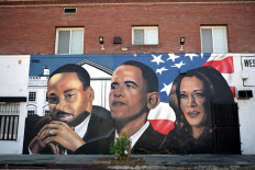 A mural by artist “4eene Vision“ depicting US minister and activist Martin Luther King Jr. (left), former US President Barack Obama (center) and US Vice President and 2024 Democratic presidential candidate Kamala Harris (right) is pictured in Los Angeles, California on August 19, 2024. Vice President Kamala Harris will formally accept the party's nomination for president at the DNC which runs from August 19-22 in Chicago. 