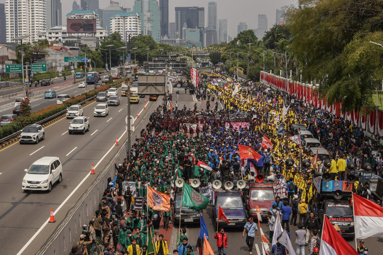 The mass action during a rally rejecting the ratification of the Revision of the Regional Election Law in front of the House of Representatives Building, Jakarta, on Thursday, August 22, 2024. The protest is part of Indonesia's emergency warning movement that went viral on social media after the House of Representatives maneuvered to ignore the Constitutional Court's decision. 