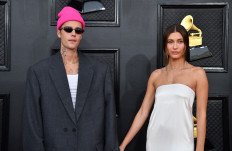 Canadian singer-songwriter Justin Bieber (left) and US model Hailey Bieber arrive for the 64th Annual Grammy Awards at the MGM Grand Garden Arena in Las Vegas on April 3, 2022.