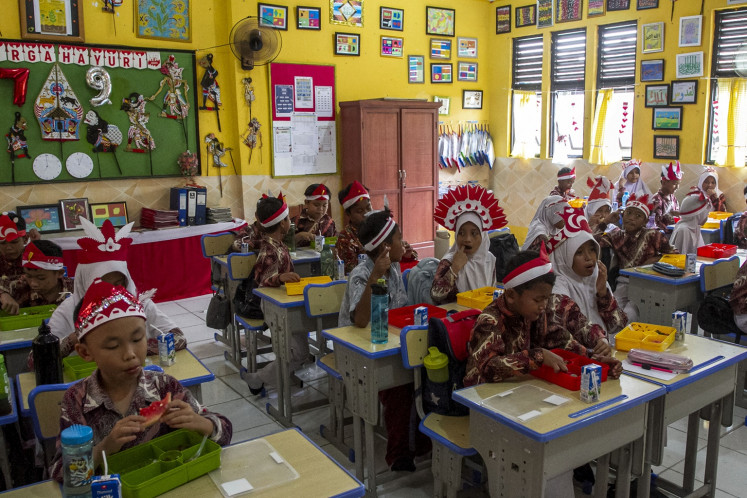 Students eat lunch during the trial of free nutritious meals program at the SDN Kedaleman IV state elementary school in Cilegon, Banten on Aug. 21, 2024. The newly-established National Nutrition Agency will oversee the implementation of the program, which is part of president-elect Prabowo Subianto's campaign promise during the 2024 presidential election.