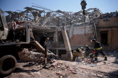 Ukrainian emergency personnel work among the rubble of a destroyed hotel following a Russian strike, amid the Russian invasion of Ukraine, in the town of Kramatorsk, Ukraine, Aug. 25, 2024. 