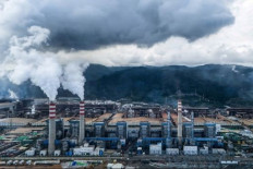 Struggling industry: Smoke billows out of the chimneys of nickel smelting plants on July 7, 2024, at the Indonesia Weda Bay Industrial Park (IWIP) in Lelilef village, Central Halmahera regency, North Maluku.