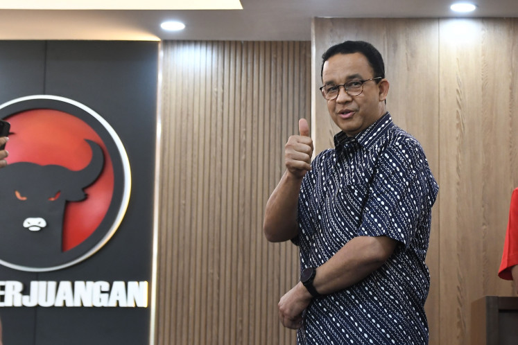 Former Jakarta governor Anies Baswedan greets reporters on Aug. 24, 2024 during his visit to the Jakarta headquarters of the Indonesian Democratic Party of Struggle (PDI-P) in Cakung, East Jakarta.
