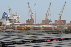 Trucks loaded with wheat arrive at the Deendayal Port Authority seaport at Kandla in India's Gujarat state on May 18, 2022.