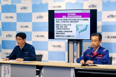 Officials from the Japan Meteorological Agency (left) and the Ministry of Land, Infrastructure, Transport and Tourism hold a joint press conference regarding the special warning for Typhoon Shanshan in Tokyo on August 28, 2024. Japan braced on August 28, for its strongest typhoon of the year, with authorities advising tens of thousands of people to evacuate and issuing the highest warning level for wind and storm surges on the main southern island of Kyushu. 