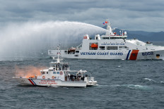A Vietnamese Coast Guard ship fires water cannon during a joint maritime exercise between the Philippine Coast Guard and Vietnamese Coast Guard in the waters of Bataan province, Philippines on Aug. 9, 2024.