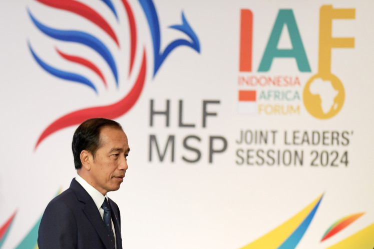 President Joko "Jokowi" Widodo walks before chairing the leaders-level meeting at the Indonesia-Africa Forum (IAF) in Nusa Dua, Bali on  September 2, 2024.