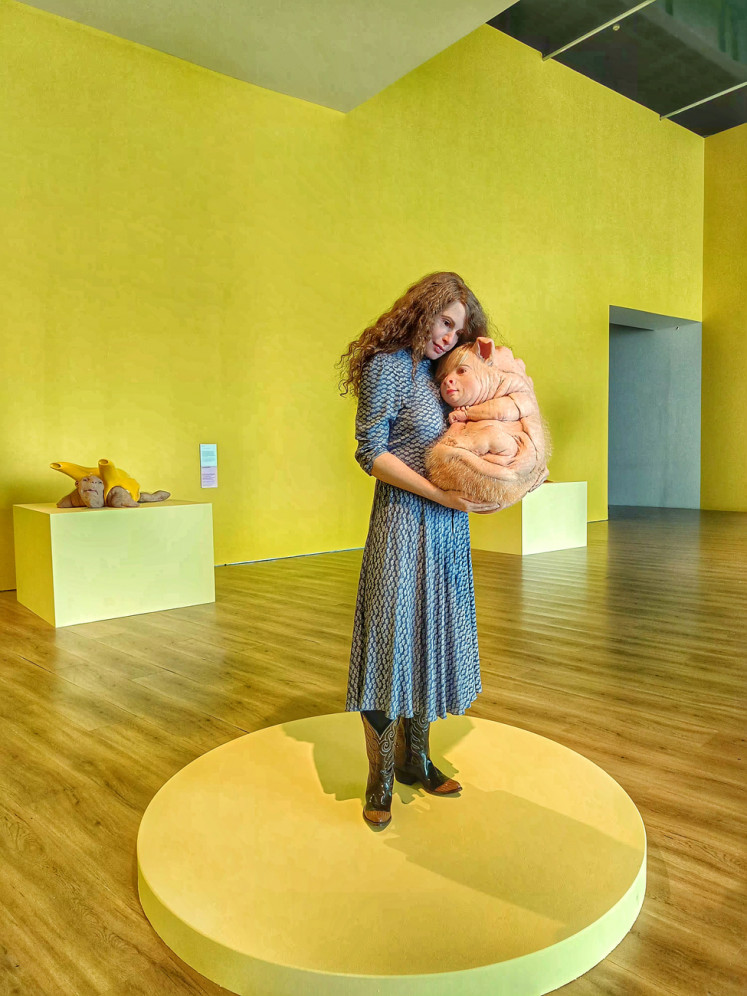 “The Bond“ (2016) features a life-like sculpture of a woman holding a baby chimera. The artwork suggests that humans should take responsibility for the world that we change.  