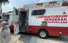 Soekarno-Hatta International Airport's Health Quarantine Center official shows a mobile surveillance laboratory parked at the Terminal 3 apron in Tangerang, Banten on Sept. 2, 2024. The airport health quarantine center deployed the mobile laboratory as a surveillance effort amid the global uptick on mpox cases.
