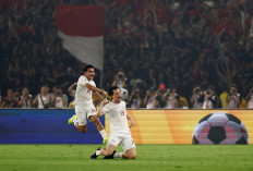 Indonesian national soccer team player Thom Haye (right) celebrates scoring the game’s first goal with teammate Asnawi Mangkualam during the AFC Asian Qualifiers Group F match between Indonesia and the Philippines at Gelora Bung Karno Stadium in Jakarta on June 11, 2024.