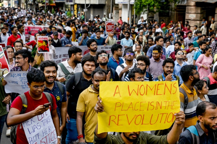 Junior doctors hold placards and shout slogans during a protest to demand the resignation of city police commissioner and condemn the rape and murder of a medic in Kolkata, India on Sept. 2, 2024. The discovery of the 31-year-old doctor's bloodied body at a state-run hospital in Kolkata on Aug. 9 stoked nationwide anger at the chronic issue of violence against women, that sparked strikes by medics and rallies backed by thousands of ordinary citizens across India.