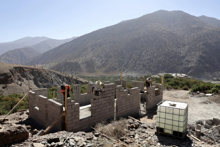 Workers construct a new house in Douar Tiniskt, in the el-Haouz province in the High Atlas Mountains south of Marrakesh, on Aug. 27, 2024, almost a year after a devastating 6.8-magnitude earthquake struck the country. The 6.8-magnitude quake killed almost 3,000 people and damaged the homes of over two million people across the High Atlas region.