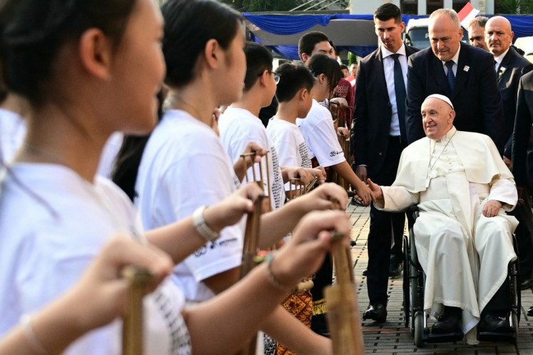 Pope Francis is welcomed on Sept. 4, 2024, as he arrives at the Jakarta Cathedral in Jakarta. Pope Francis' grueling Asia-Pacific tour got into full swing on Sept. 4 with the 87-year-old appearing in good health and strong spirits as he met President Joko “Jokowi“ Widodo and other political figures.