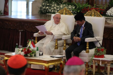 Pope Francis (left) looks at President Joko “Jokowi“ Widodo (right) when addressing Indonesian political figures and foreign ambassadors at the Merdeka Palace in Jakarta on Sept. 4, 2024.