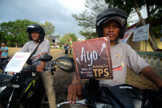 Members of a subdistrict election committee (PPK) take part in a parade on Sept. 5, 2024 in Tegal regency, Central Java, to promote and educate voters on this year’s regional head elections, which is being held simultaneously for the first time in history.