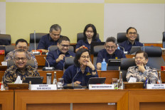 Finance Minister Sri Mulyani Indrawati (center), National Development Planning Minister Suharso Monoarfa (right) and Bank Indonesia Governor Perry Warjiyo (left) attend a meeting with the House of Representatives' Budget Committee (Banggar) at the Senayan legislative complex in Jakarta on Sept. 4, 2024.