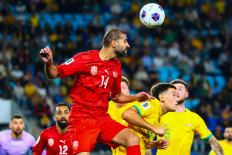 Bahrain's Ali Haram (third left) leaps over Australia's Alessandro Circati (second right) during the 2026 FIFA World Cup AFC qualifiers football match between Australia and Bahrain at Cbus Super Stadium on the Gold Coast on September 5, 2024. 
