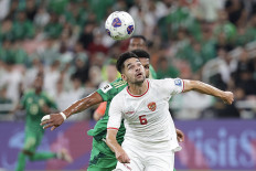 Indonesian soccer player Sandy Walsh (front) is challenged for the ball by a Saudi Arabian player during their third round match in Group C of the World Cup Asian Zone qualifier at King Abdullah Sports City stadium in Jeddah, Saudi Arabia on Sept. 5, 2024. The Match ended in a 1-1 draw.