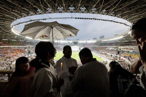 Mass observance: A priest gives Holy Communion to the faithful during a Mass led by Pope Francis at Gelora Bung Karno Main Stadium in Jakarta on Sept. 5, 2024.