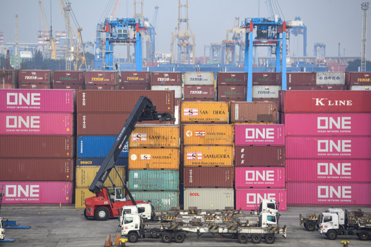 Containers are moved on Sept. 10, 2024, at the Jakarta International Container Terminal (JICT) in Tanjung Priok, North Jakarta.