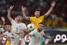 Australia's Cameron Burgess (back, center) reacts next to Indonesia's Sandy Walsh (center. left) and Indonesia's Calvin Verdonk (front, right) during the 2026 FIFA World Cup Asian qualification football match between Indonesia and Australia at Gelora Bung Karno Stadium in Jakarta on Sept. 10, 2024.