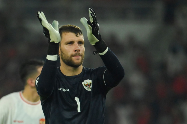 Indonesian goalkeeper Maarten Paes greets supporters after a 2026 World Cup Asian qualification soccer match between Indonesia and Australia at the Gelora Bung Karno stadium in Jakarta on Sept. 10, 2024. Indonesia holds Australia to a 0-0 draw in the match.