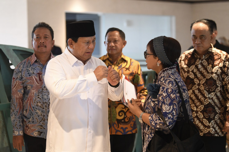 Defense Minister and president-elect Prabowo Subianto (second left) talks with Foreign Minister Retno LP Marsudi (second right) ahead of the final cabinet meeting at the Garuda Palace in Nusantara Capital City (IKN), North Penajam Paser regency, East Kalimantan on Sept. 13, 2024.