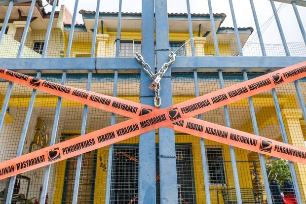 The sealed-off gate outside a welfare home – one of 20 homes raided by police and from where children were rescued – is seen in Kajang, Malaysia, Sept. 12, 2024.