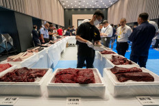 Various cuts of fin whale meat are displayed at the exhibition and business meeting of domestically produced fin whales hosted by Japan's whaling company Kyodo Senpaku at Tokyo's Toyosu market on Sept. 13, 2024. Bite-size bits of fin whale were available to sniff and taste on Sept. 13 as Japan's whaling industry seeks to rekindle appetite for a protein source that has largely fallen out of favor.