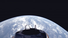 A view of Earth and the Dragon capsule's Skywalker shortly after the Polaris Dawn crew launched into orbit on Sept. 10, 2024. A private crew set out on an audacious orbital expedition September 10, journeying deeper into the cosmos than any humans in half a century as they prepare for the first ever spacewalk by non-professional astronauts. The SpaceX Polaris Dawn mission, led by Shift4 Payments CEO Jared Isaacman, launched from the Kennedy Space Center in Florida and should by the end of its first day attain a peak altitude of 1,400 kilometers
