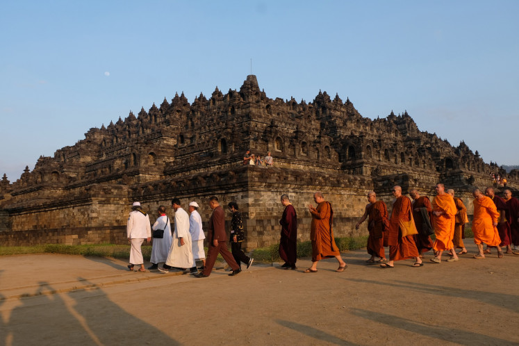 Sacred ceremony: Various religious leaders, along with Buddhist priests and monks, walk around the Borobudur Temple in Magelang, Central Java, during a pradakshina ritual on Aug. 17, 2024, to commemorate the 79th Independence Day.