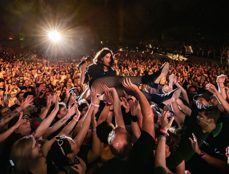 True performer: St. Vincent is pictured crowd surfing in her show at The Greek Theatre in Los Angeles, United States, in August. (Instagram/Courtesy of Ed Davis)