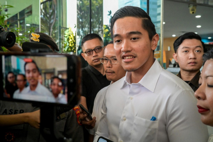 Kaesang Pangarep, the youngest son of President Joko “Jokowi“ Widodo, answers questions from journalists while leaving the Corruption Eradication Commission (KPK) building in Jakarta on September 17, 2024, after being summoned by the KPK to provide clarification on the use of a private jet for a business trip to the US.