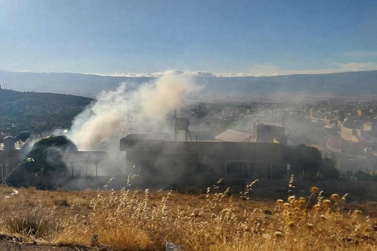 Smoke billows from a house in Baalbek in east Lebanon after a reported explosion of a radio device, on September 18, 2024, amid ongoing cross-border tensions between Israel and Hezbollah fighters. Communication devices exploded on July 18 in Hezbollah strongholds in Lebanon, as the Iran-backed group vowed to retaliate against Israel after a deadly wave of pager blasts that has raised fears of an all-out war. 