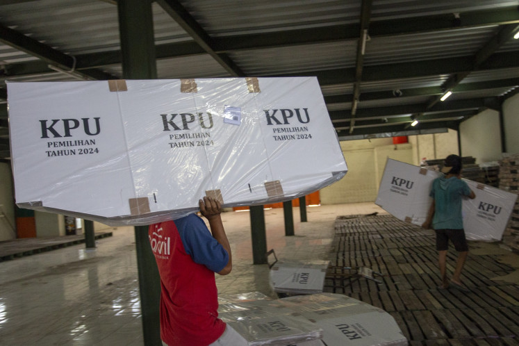 Workers transport ballot boxes for the 2024 simultaneous regional elections to the Cirebon General Elections Commission (KPU) warehouse in Cirebon, West Java, on Sept. 19, 2024.