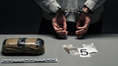 An illustration of a drug arrest.