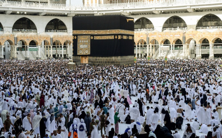 Pilgrims perform the tawaf al-Ifada, a mandatory circumambulation around the Kaaba, Islam's holiest shrine, at the climax of the annual haj at the Grand Mosque in Saudi Arabia's holy city of Mecca, on Aug. 11, 2019. 