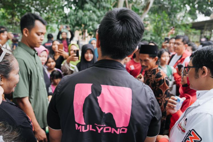 Indonesian Solidarity Party (PSI) chairman Kaesang Pangarep wears a vest with the words “Putra Mulyono”, or the son of Mulyono, the birth name of his father outgoing President Joko “Jokowi” Widodo, during a visit to Jambe, Tangerang regency in Banten on September 25, 2024.