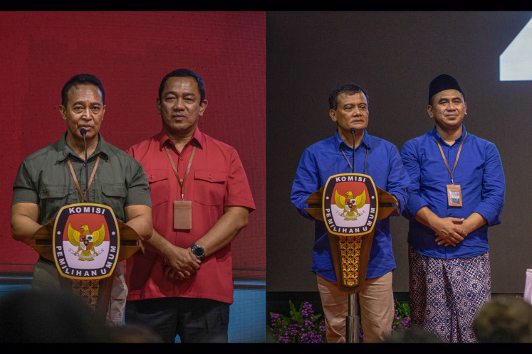 A photo collage of Central Java gubernatorial candidate pairs Andika Perkasa-Hendrar Prihadi (left) and Ahmad Luthfi-Taj Yasin (right) during a Central Java General Elections Commission (KPU) plenary meeting in Semarang, Central Java on Sept. 23, 2024.