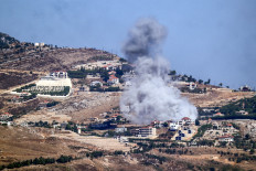 A cloud of smoke erupts during an Israeli air strike on the village of Sujud in southern Lebanon on Sept. 25, 2024. Israel announced dozens of new air strikes on Hezbollah strongholds in Lebanon on Sept. 24, a day after 492 people, including 35 children, were killed in the deadliest bombardment since a devastating war in 2006.